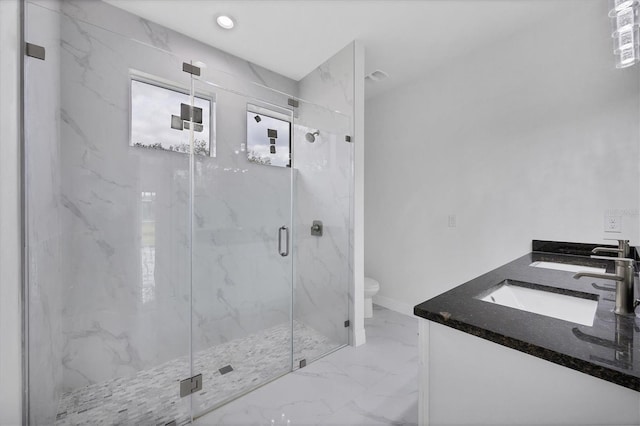 bathroom with vanity, walk in shower, and toilet