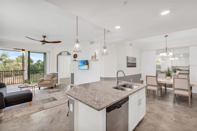 kitchen with sink, white cabinetry, dishwasher, hanging light fixtures, and a center island with sink