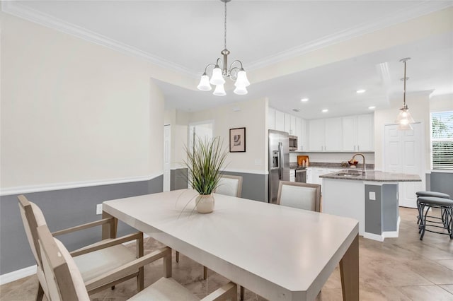 dining area featuring sink, an inviting chandelier, ornamental molding, and light tile patterned floors