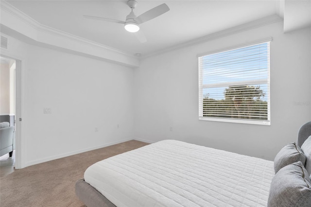 bedroom with ceiling fan, crown molding, carpet, and multiple windows