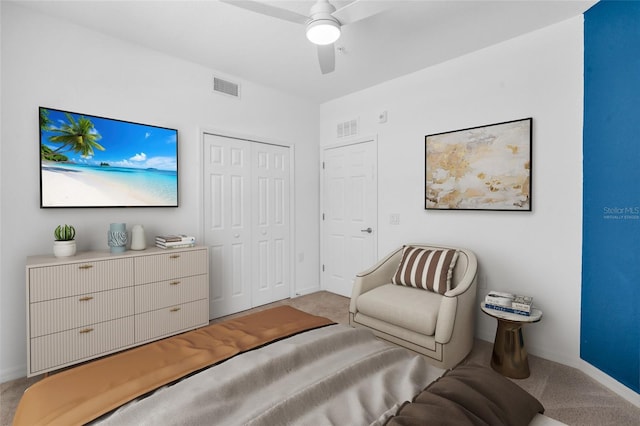 living area featuring ceiling fan and light colored carpet