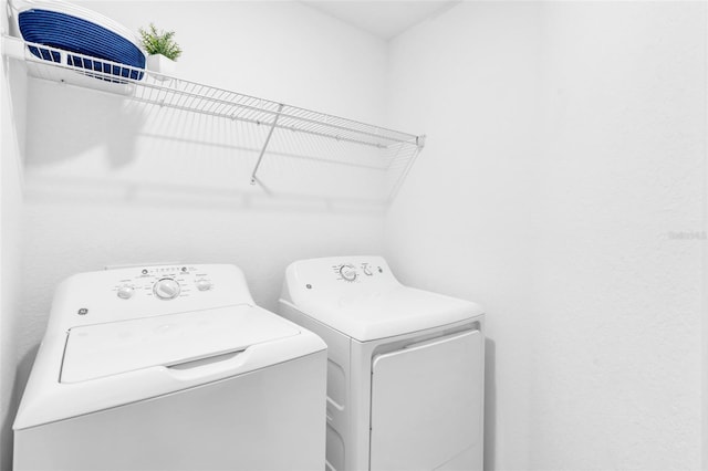 laundry room featuring washer and clothes dryer