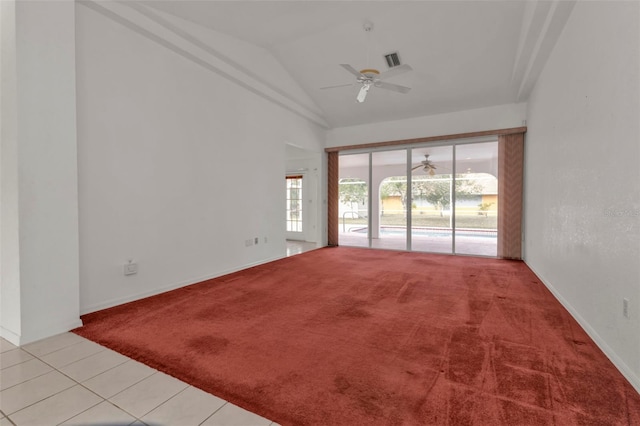 carpeted spare room featuring ceiling fan and lofted ceiling