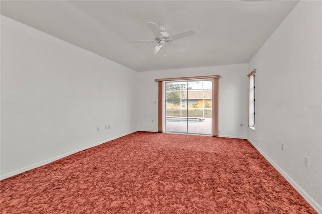 unfurnished room with ceiling fan and carpet floors