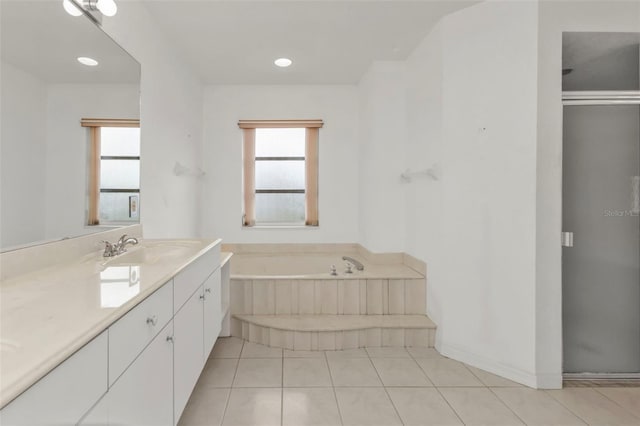 bathroom featuring tile patterned floors, separate shower and tub, and vanity