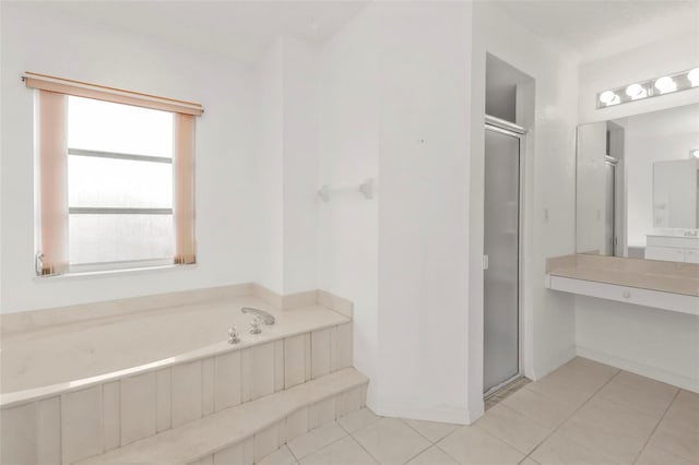 bathroom with tile patterned flooring, a wealth of natural light, and plus walk in shower