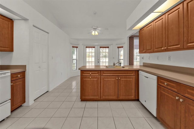 kitchen with dishwasher, french doors, sink, kitchen peninsula, and ceiling fan