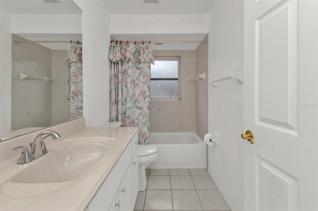 full bathroom featuring toilet, tile patterned flooring, vanity, and shower / bath combo with shower curtain