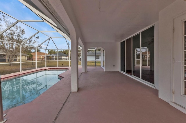 view of pool featuring a lanai and a patio