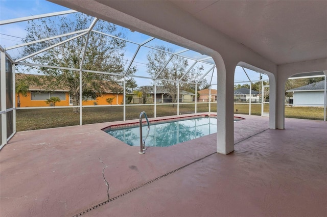 view of swimming pool with a lanai, a patio area, and a yard