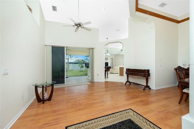 living room featuring ceiling fan and light wood-type flooring