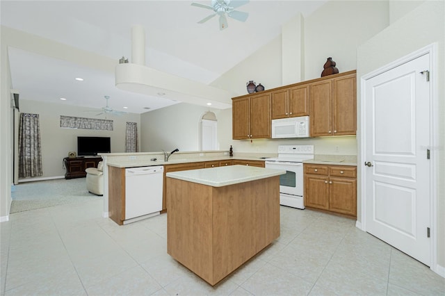 kitchen with a kitchen island, high vaulted ceiling, ceiling fan, kitchen peninsula, and white appliances