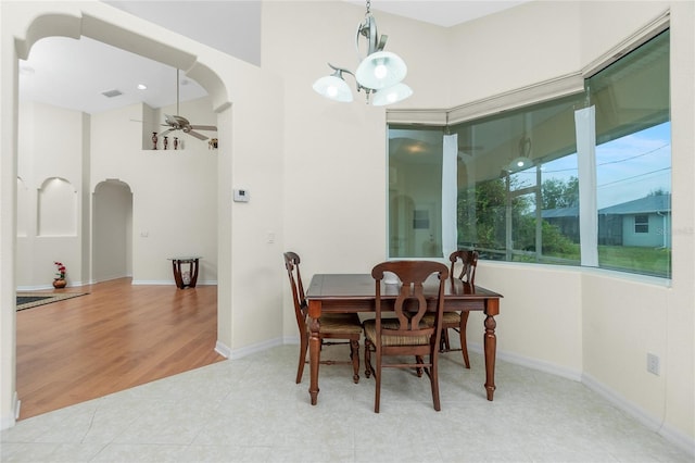 dining area featuring light tile patterned flooring and ceiling fan