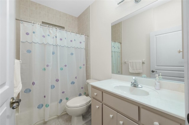 bathroom with tile patterned flooring, vanity, and toilet