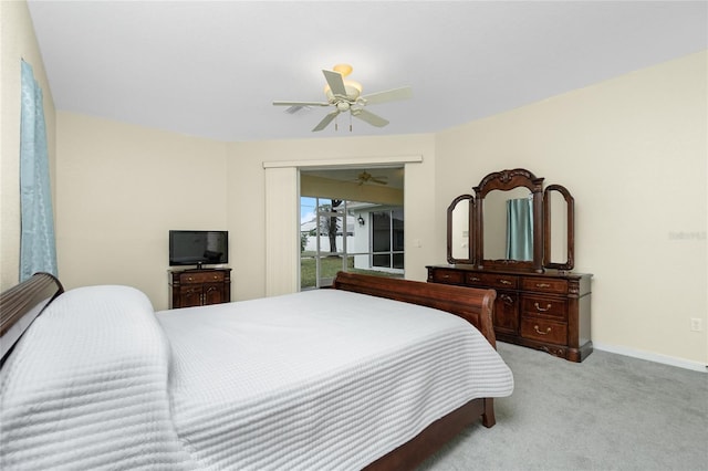 carpeted bedroom featuring ceiling fan and access to exterior