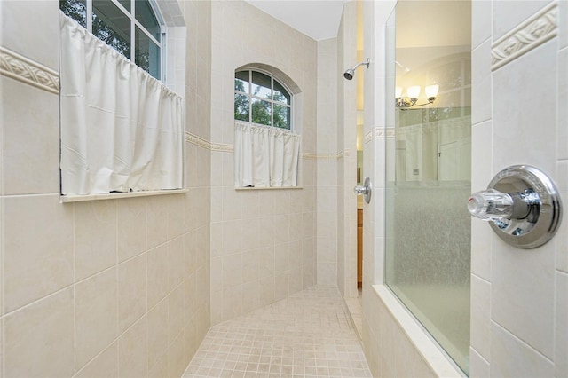 bathroom featuring a tile shower