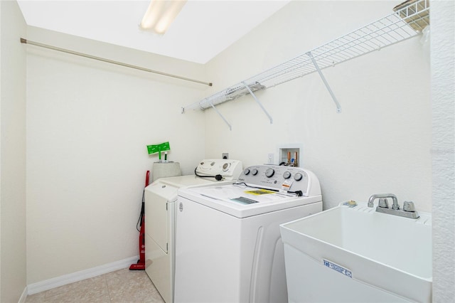 laundry area featuring sink and washing machine and dryer