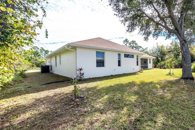 back of house featuring a yard