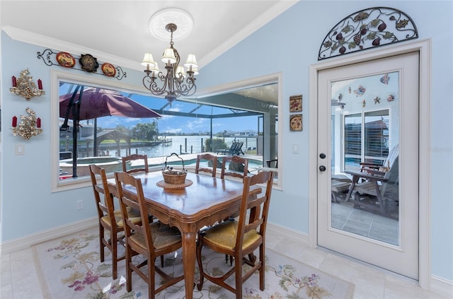 dining space with ornamental molding, lofted ceiling, a sunroom, and an inviting chandelier