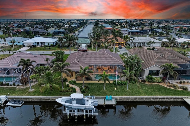 aerial view at dusk with a water view