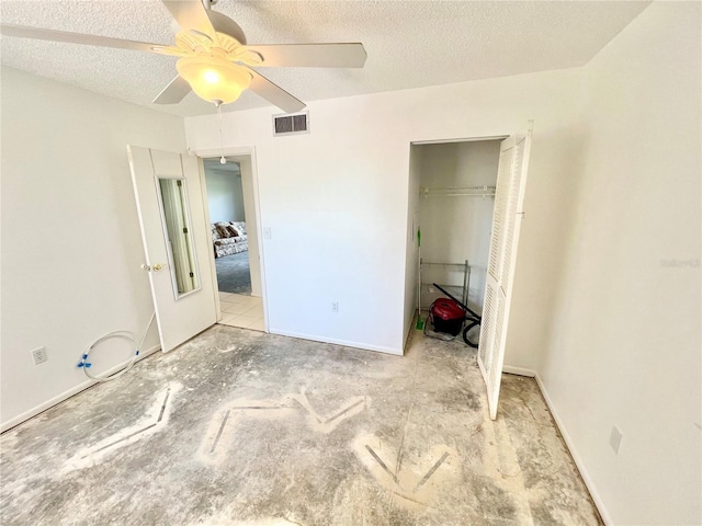 unfurnished bedroom with ceiling fan, a closet, and a textured ceiling