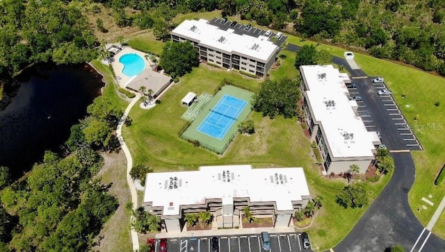 birds eye view of property with a water view