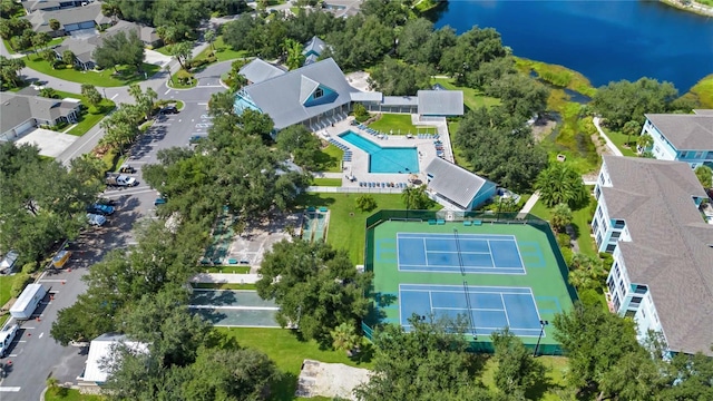 birds eye view of property with a water view