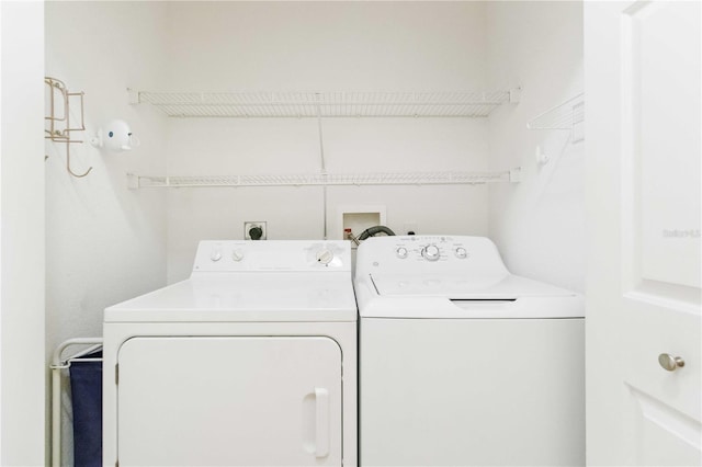 washroom with separate washer and dryer