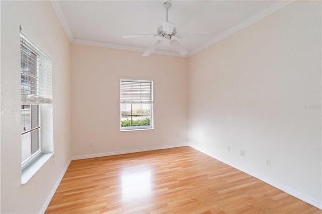 spare room featuring ceiling fan, light hardwood / wood-style flooring, and crown molding