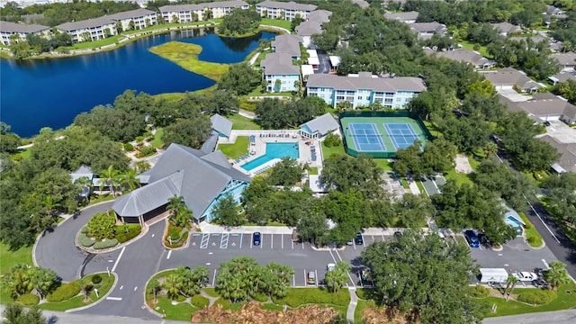 birds eye view of property with a water view