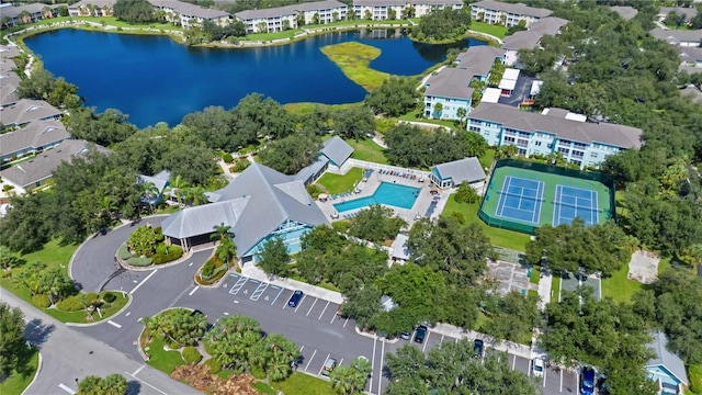 birds eye view of property with a water view