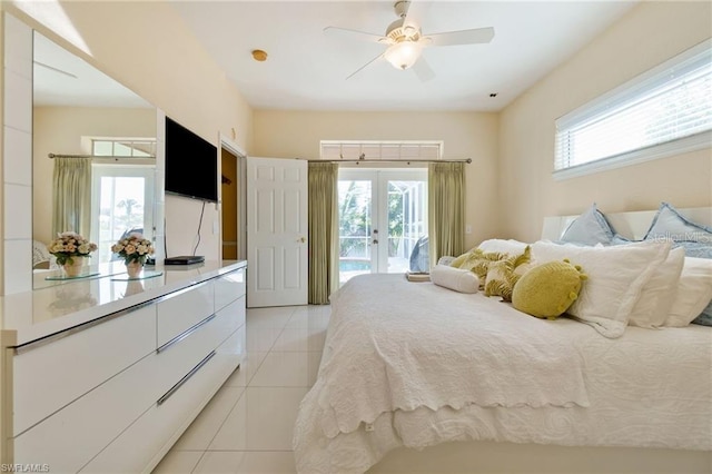 tiled bedroom with french doors, ceiling fan, and access to outside