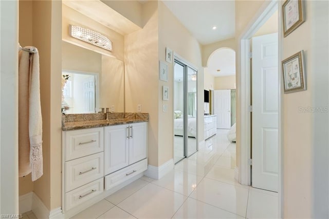 bathroom with tile patterned flooring and vanity