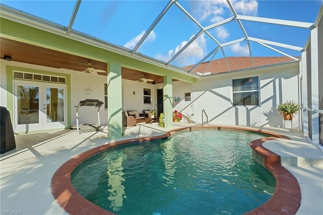 view of pool featuring french doors, a lanai, ceiling fan, and a patio