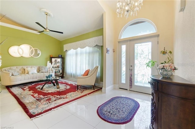 entryway with lofted ceiling, light tile patterned floors, and a healthy amount of sunlight