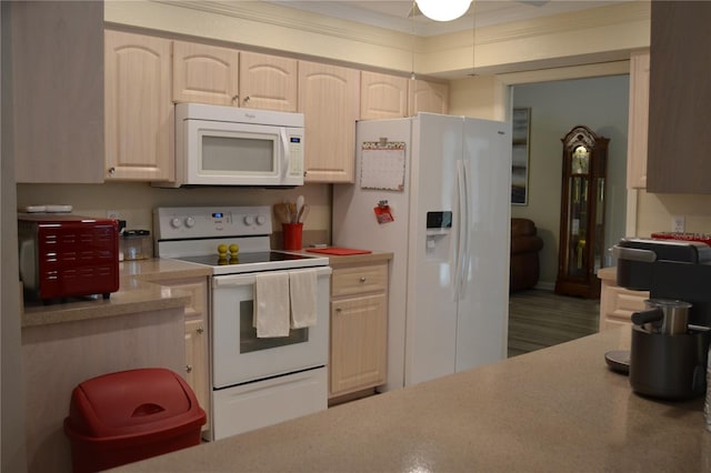 kitchen featuring white appliances and ornamental molding