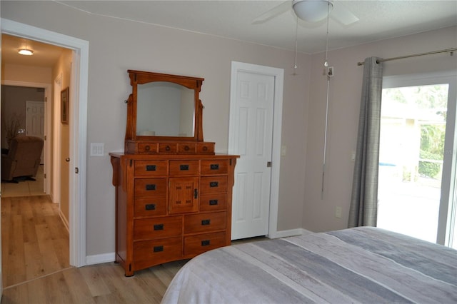 bedroom featuring light wood-type flooring, access to exterior, and ceiling fan