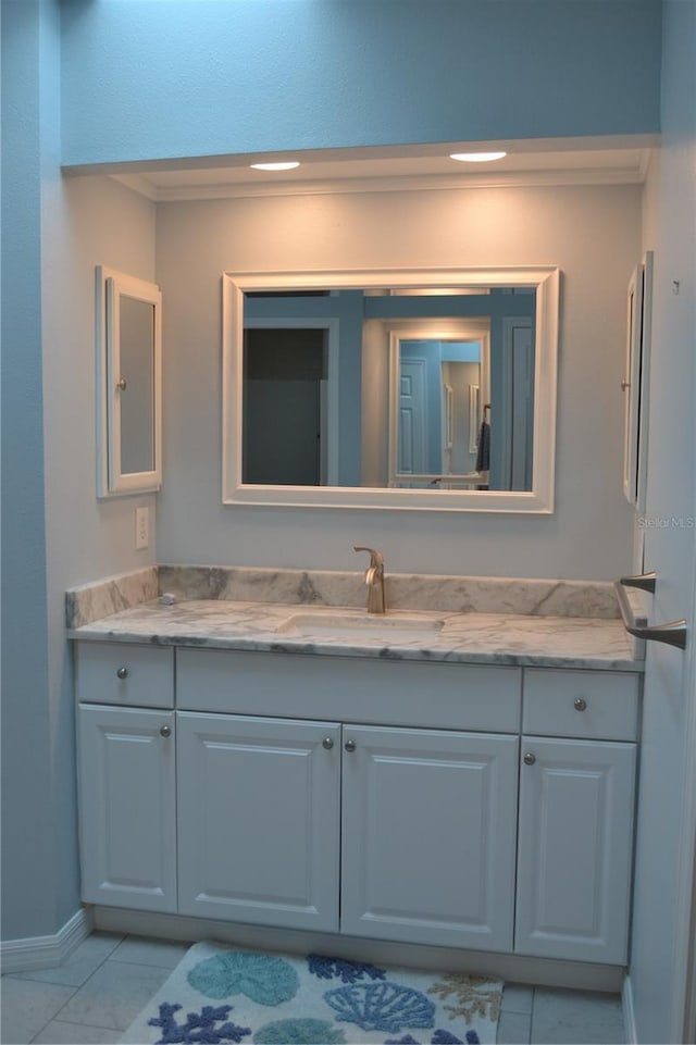 bathroom featuring tile patterned flooring and vanity