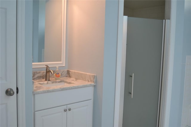 bathroom featuring vanity and a shower