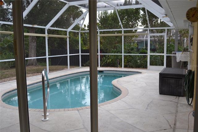 view of pool featuring a lanai and a patio area