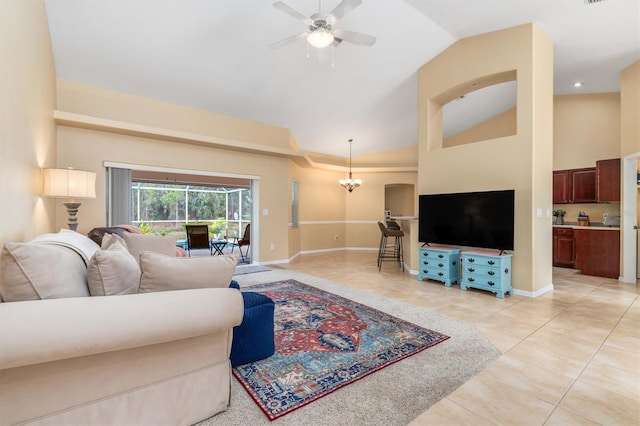 living room featuring lofted ceiling, light tile patterned floors, and ceiling fan with notable chandelier