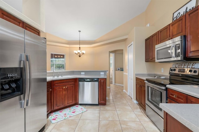 kitchen featuring pendant lighting, stainless steel appliances, an inviting chandelier, sink, and light tile patterned floors