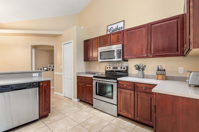 kitchen featuring light tile patterned floors and appliances with stainless steel finishes