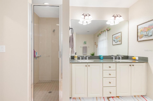 bathroom featuring walk in shower and vanity