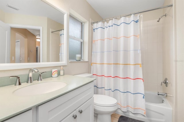 full bathroom featuring toilet, shower / tub combo, tile patterned floors, and vanity