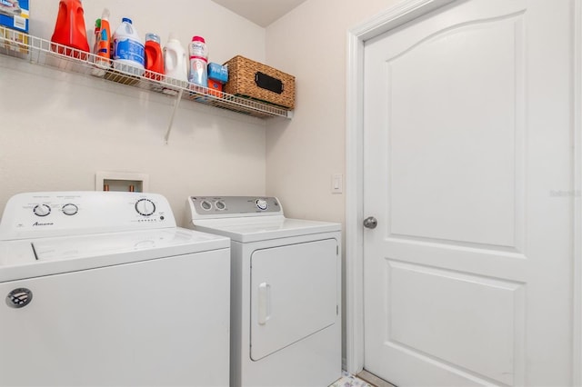 clothes washing area featuring washer and clothes dryer