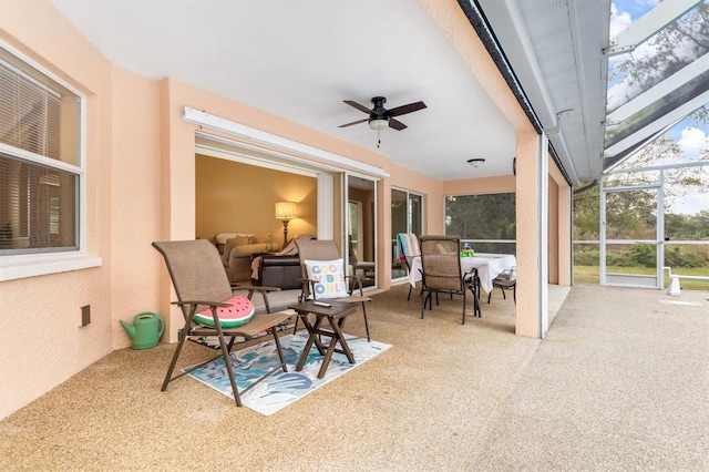 view of patio / terrace with glass enclosure and ceiling fan