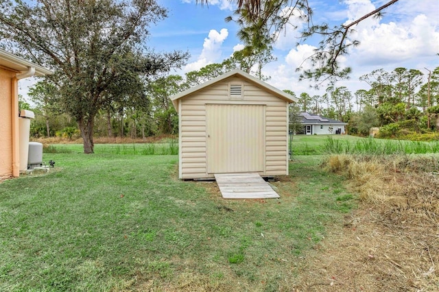 view of outdoor structure with a yard