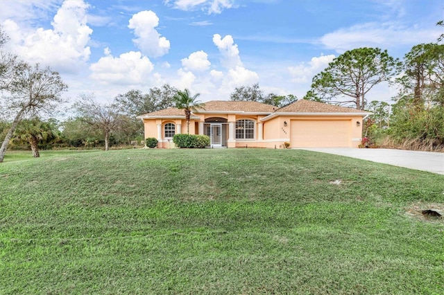 view of front facade with a front lawn and a garage