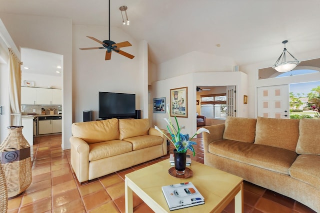 living room featuring ceiling fan, light tile patterned floors, and high vaulted ceiling